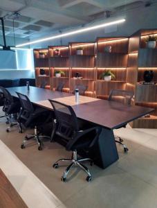 a conference room with a large table and chairs at RN STUDIO PREMIUM Ap 321 in Maceió +35 photos