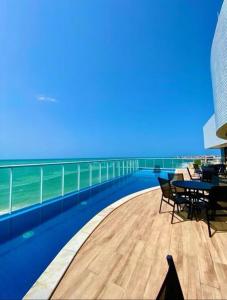 a view of the ocean from the balcony of a resort at RN STUDIO PREMIUM Ap 321 in Maceió