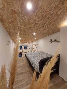 a bedroom with a bed and a stone ceiling at Le Studio de L'Ayguade - Plage à 100 m in Hyères +17 photos