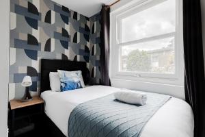 Postel nebo postele na pokoji v ubytování Wembar Hotel