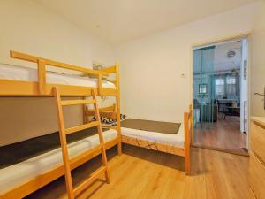 a room with bunk beds and a living room at Robinson House Destina in Bogomolje +59 photos