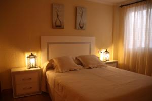 Postel nebo postele na pokoji v ubytování Excelsior Beachfront Apartment Calpe