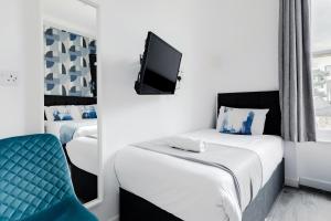 Postel nebo postele na pokoji v ubytování Wembar Hotel