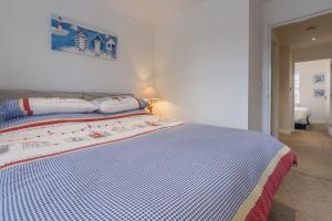 Postel nebo postele na pokoji v ubytování Blossom Cottage 4