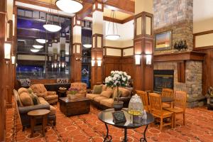 a living room filled with furniture and a fireplace at The Lodge at Big Sky in Big Sky