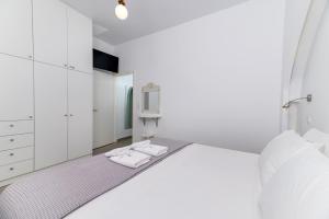 Postel nebo postele na pokoji v ubytování AquaLung Suites