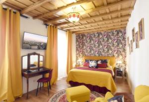 a bedroom with a bed and a table and a window at B&B Ventisei Scalini A Trastevere in Rome +165 photos