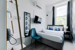 Postel nebo postele na pokoji v ubytování Wembar Hotel