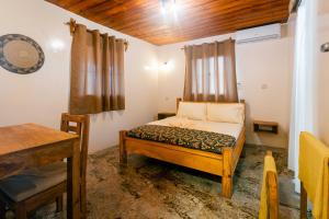 Postel nebo postele na pokoji v ubytování Roots inn