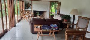 a living room with a couch and a table at Casa de campo, La Resolana in Rivera