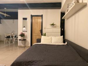 a bedroom with a large bed and a table at Center underground studio in Bratislava