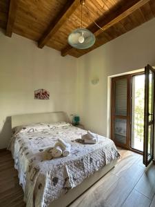 Letto o letti in una camera di BORGO DON ARMANDO - Appartamento A B C E