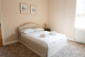 Postel nebo postele na pokoji v ubytování Casa Arkles - next to stadium - free parking