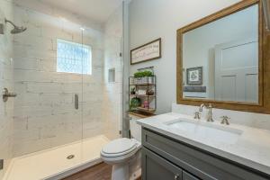 a bathroom with a sink and a shower and a toilet at Mountain Sunrise in Black Mountain +36 photos