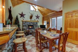 a living room with a table and a fireplace at second wind in Pigeon Forge