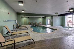 a pool in the middle of a room with benches at second wind in Pigeon Forge