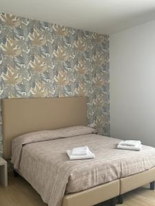 Postel nebo postele na pokoji v ubytování Guest House al porto