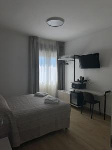Postel nebo postele na pokoji v ubytování Guest House al porto