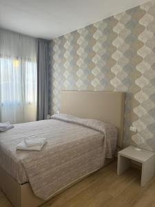 Postel nebo postele na pokoji v ubytování Guest House al porto