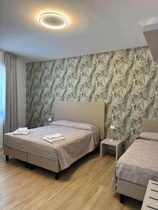Postel nebo postele na pokoji v ubytování Guest House al porto