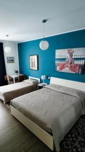 Postel nebo postele na pokoji v ubytování Residenza Capitello 48