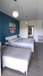 Postel nebo postele na pokoji v ubytování Residenza Capitello 48
