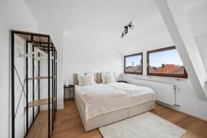 Ένα ή περισσότερα κρεβάτια σε δωμάτιο στο Malu Rooms - Top Lage, Kostenloser Parkplatz, Klima, Netflix, 24h Checkin +10 φωτογραφίες