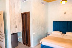 Postel nebo postele na pokoji v ubytování Kare No Hotel Tsaghkadzor