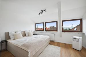 Ένα ή περισσότερα κρεβάτια σε δωμάτιο στο Malu Rooms - Top Lage, Kostenloser Parkplatz, Klima, Netflix, 24h Checkin