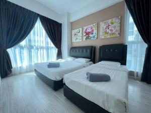a bedroom with two beds and a large window at Sutera Avenue KK Infinity Pool 10 mins to Airport 10 mins to Jetty LSS HomeStay in Kota Kinabalu +135 photos