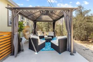 a gazebo with chairs and tables on a patio at 10 Min Drive to the Sequoias in Three Rivers