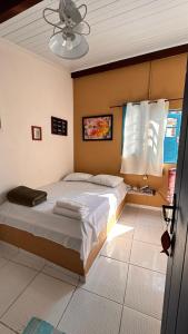 Cama ou camas em um quarto em Pousada Canto do Mar Ilha Grande