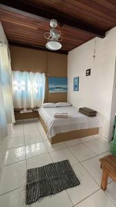 Cama ou camas em um quarto em Pousada Canto do Mar Ilha Grande