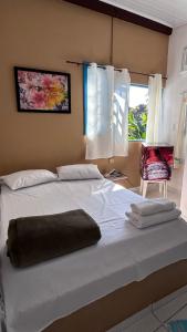 Cama ou camas em um quarto em Pousada Canto do Mar Ilha Grande
