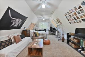 a living room with a couch and a table at Hathaway Hideaway Loft Apartment in Hathaway Pines