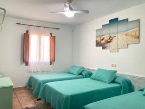 A bed or beds in a room at Cortijo Los Garridos - 8 huéspedes