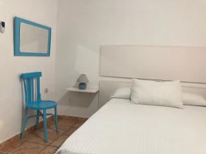 A bed or beds in a room at Cortijo Los Garridos - 8 huéspedes