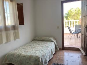 A bed or beds in a room at Cortijo Los Garridos - 8 huéspedes