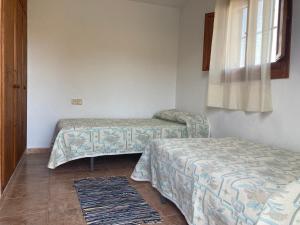 A bed or beds in a room at Cortijo Los Garridos - 8 huéspedes