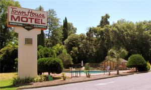 a motel sign on the side of a road at Town House Motel in Chico