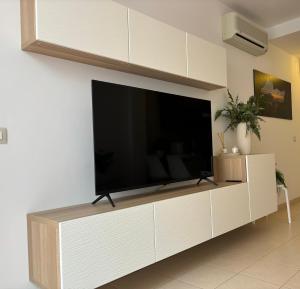 a large flat screen tv on a white wall at Vamos Tenerife - Playa La Arena - Puerto De Santiago in Puerto de Santiago