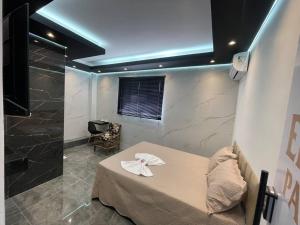 En eller flere senge i et værelse på Suíte Silver 202