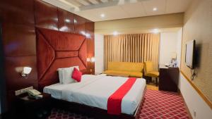 Ένα ή περισσότερα κρεβάτια σε δωμάτιο στο West Park Inn Dhaka