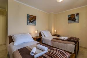 Postel nebo postele na pokoji v ubytování Villa Divina