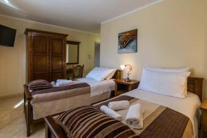 Postel nebo postele na pokoji v ubytování Villa Divina + 37 fotografií