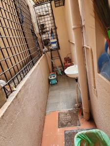 a small bathroom with a sink and a toilet at Anusattva Vatika in Bengaluru
