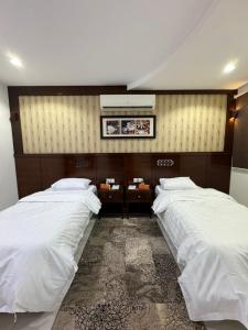 Ένα ή περισσότερα κρεβάτια σε δωμάτιο στο شقق العاصمة