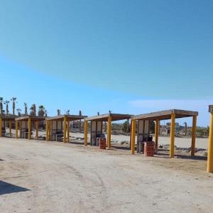 a row of metal structures on a dirt road at Spectacular 3BR 3BA San Felipe Villa with WiFi FREE GOLF in Playa El Paraíso +34 photos