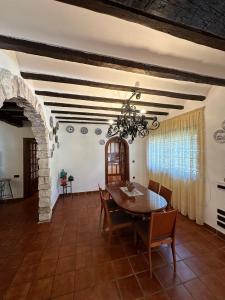 a dining room with a table and chairs at Finca Paraíso Rural in El Burgo de Osma