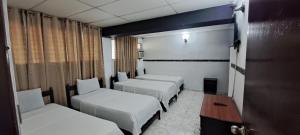 Postel nebo postele na pokoji v ubytování NUEVA ADM- Hotel Occidental